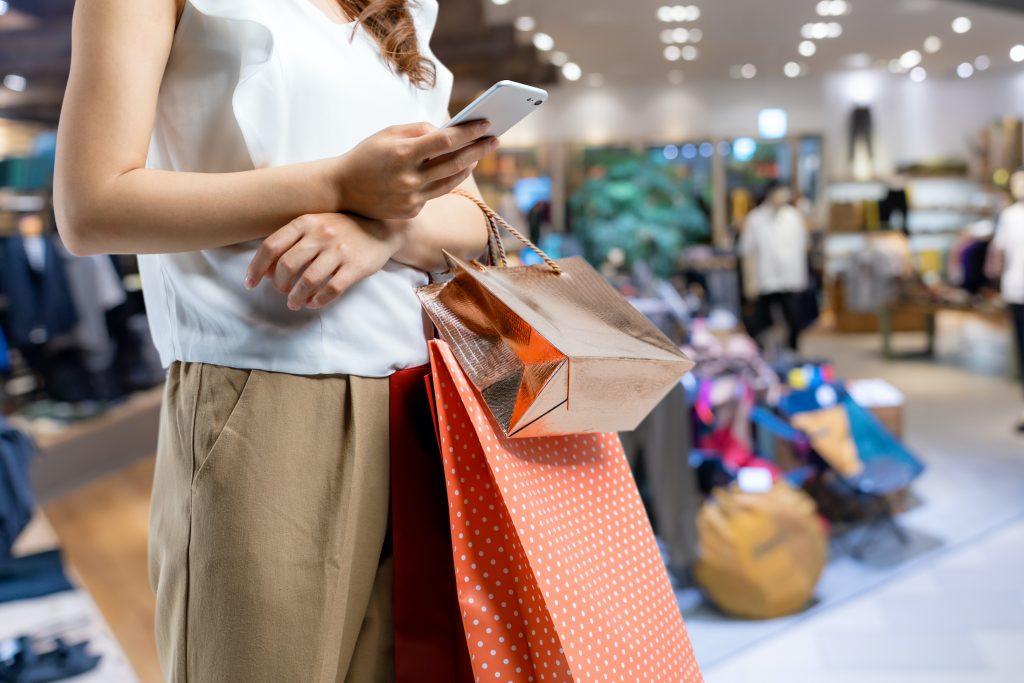 Female shopper searching for product on mobile social media apps